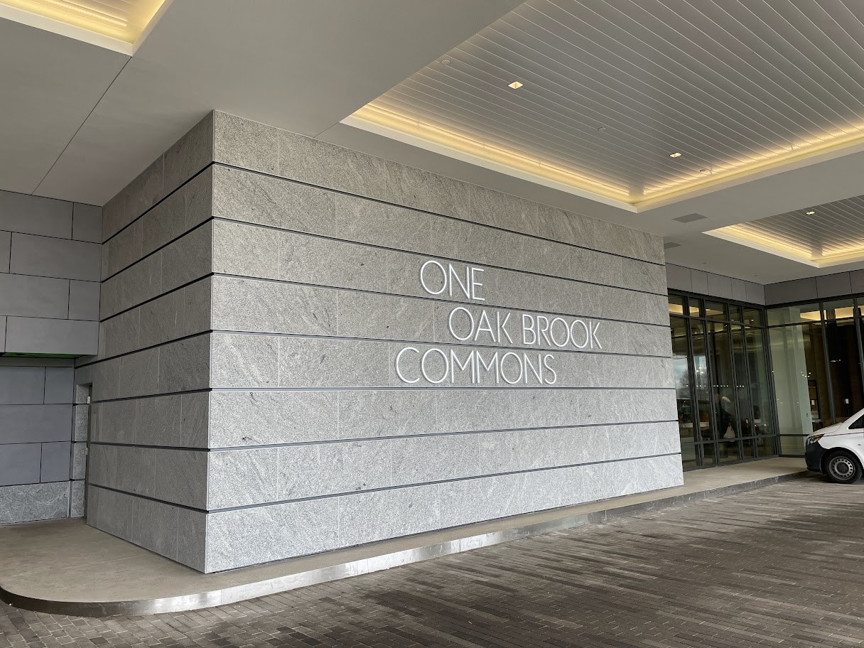 A building with the words " one call book commons ".